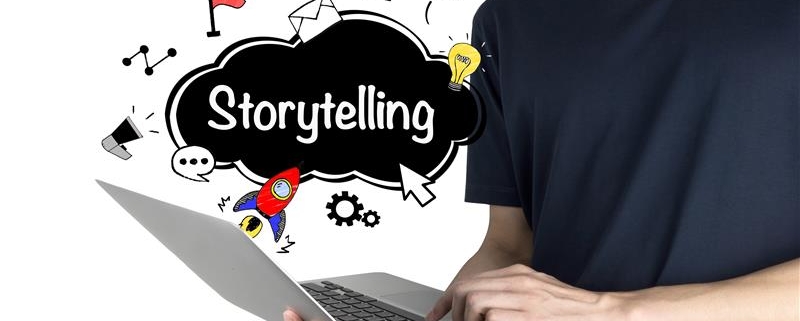 Person using a laptop with creative icons and the word "Storytelling" displayed, representing how managed IT services in New York support immersive digital content creation and seamless storytelling experiences.